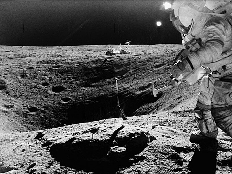 Astronaut sampling the lunar surface close to Plum crater