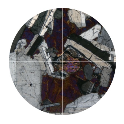 Image under crossed polars of plagioclase crystals with inclined extinction