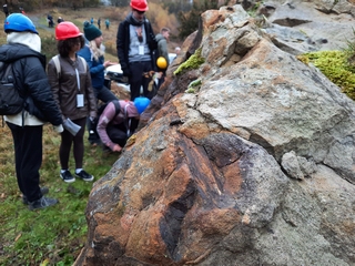 Students examining a sandstone exposure at Saltwells